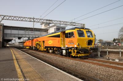 image showing a large yellow on-track machine